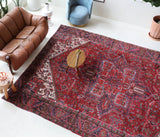 Antique Persian area rug in a living room setting, pile rug, vintage rug, portland, rug shop, bright colors, wild shaman, soft rug, bold color, Portland, Oregon, rug store, rug shop, local shop, antique rug, Persian rug, handmade rug, wool rug, distressed rug