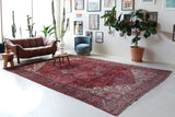 Antique Persian area rug in a living room setting, pile rug, vintage rug, portland, rug shop, bright colors, wild shaman, soft rug, bold color, Portland, Oregon, rug store, rug shop, local shop, antique rug, Persian rug, handmade rug, wool rug, distressed rug