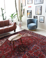 Antique Persian area rug in a living room setting, pile rug, vintage rug, portland, rug shop, bright colors, wild shaman, soft rug, bold color, Portland, Oregon, rug store, rug shop, local shop, antique rug, Persian rug, handmade rug, wool rug, distressed rug