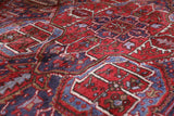 Antique Persian area rug in a living room setting, pile rug, vintage rug, portland, rug shop, bright colors, wild shaman, soft rug, bold color, Portland, Oregon, rug store, rug shop, local shop, antique rug, Persian rug, handmade rug, wool rug, distressed rug