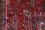 Antique Persian area rug in a living room setting, pile rug, vintage rug, portland, rug shop, bright colors, wild shaman, soft rug, bold color, Portland, Oregon, rug store, rug shop, local shop, antique rug, Persian rug, handmade rug, wool rug, distressed rug
