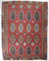 Vintage kilim rug in living room setting, old rug, antique rug, pastel colors, faded colors, Turkish rug, vintage rug, soft rug, Portland, Oregon, rug store, rug shop, local shop, earthy tones, earthy colors, warm colors