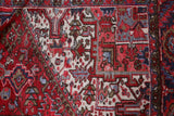 Antique Persian area rug in a living room setting, pile rug, vintage rug, portland, rug shop, bright colors, wild shaman, soft rug, bold color, Portland, Oregon, rug store, rug shop, local shop, antique rug, Persian rug, handmade rug, wool rug, distressed rug