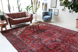 Antique Persian area rug in a living room setting, pile rug, vintage rug, portland, rug shop, bright colors, wild shaman, soft rug, bold color, Portland, Oregon, rug store, rug shop, local shop, antique rug, Persian rug, handmade rug, wool rug, distressed rug