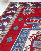 Vintage Turkish rug in a living room setting, pile rug, Turkish rug, vintage rug, portland, rug shop, bright colors, wild shaman, soft rug, bold color, Portland, Oregon, rug store, rug shop, local shop, antique rug