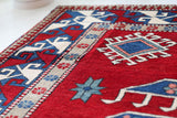 Vintage Turkish rug in a living room setting, pile rug, Turkish rug, vintage rug, portland, rug shop, bright colors, wild shaman, soft rug, bold color, Portland, Oregon, rug store, rug shop, local shop, antique rug