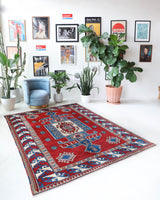 Vintage Turkish rug in a living room setting, pile rug, Turkish rug, vintage rug, portland, rug shop, bright colors, wild shaman, soft rug, bold color, Portland, Oregon, rug store, rug shop, local shop, antique rug
