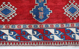 Vintage Turkish rug in a living room setting, pile rug, Turkish rug, vintage rug, portland, rug shop, bright colors, wild shaman, soft rug, bold color, Portland, Oregon, rug store, rug shop, local shop, antique rug