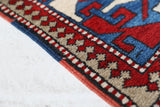 Vintage Turkish rug in a living room setting, pile rug, Turkish rug, vintage rug, portland, rug shop, bright colors, wild shaman, soft rug, bold color, Portland, Oregon, rug store, rug shop, local shop, antique rug