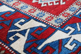Vintage Turkish rug in a living room setting, pile rug, Turkish rug, vintage rug, portland, rug shop, bright colors, wild shaman, soft rug, bold color, Portland, Oregon, rug store, rug shop, local shop, antique rug