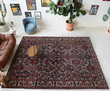 Antique Persian area rug in a living room setting, pile rug, vintage rug, portland, rug shop, bright colors, wild shaman, soft rug, bold color, Portland, Oregon, rug store, rug shop, local shop, antique rug, Persian rug, handmade rug, wool rug, distressed rug