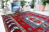 Vintage Turkish rug in a living room setting, pile rug, Turkish rug, vintage rug, portland, rug shop, bright colors, wild shaman, soft rug, bold color, Portland, Oregon, rug store, rug shop, local shop, antique rug