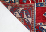 Vintage Turkish rug in a living room setting, pile rug, Turkish rug, vintage rug, portland, rug shop, bright colors, wild shaman, soft rug, bold color, Portland, Oregon, rug store, rug shop, local shop, antique rug