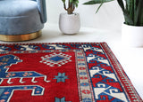Vintage Turkish rug in a living room setting, pile rug, Turkish rug, vintage rug, portland, rug shop, bright colors, wild shaman, soft rug, bold color, Portland, Oregon, rug store, rug shop, local shop, antique rug