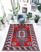 Vintage Turkish rug in a living room setting, pile rug, Turkish rug, vintage rug, portland, rug shop, bright colors, wild shaman, soft rug, bold color, Portland, Oregon, rug store, rug shop, local shop, antique rug