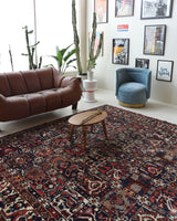 Antique Persian area rug in a living room setting, pile rug, vintage rug, portland, rug shop, bright colors, wild shaman, soft rug, bold color, Portland, Oregon, rug store, rug shop, local shop, antique rug, Persian rug, handmade rug, wool rug, distressed rug