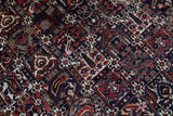 Antique Persian area rug in a living room setting, pile rug, vintage rug, portland, rug shop, bright colors, wild shaman, soft rug, bold color, Portland, Oregon, rug store, rug shop, local shop, antique rug, Persian rug, handmade rug, wool rug, distressed rug