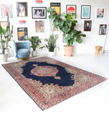 Vintage Turkish rug in a living room setting, pile rug, Turkish rug, vintage rug, portland, rug shop, bright colors, wild shaman, soft rug, bold color, Portland, Oregon, rug store, rug shop, local shop, antique rug