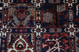 Antique Persian area rug in a living room setting, pile rug, vintage rug, portland, rug shop, bright colors, wild shaman, soft rug, bold color, Portland, Oregon, rug store, rug shop, local shop, antique rug, Persian rug, handmade rug, wool rug, distressed rug