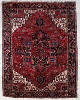 Antique Persian area rug in a living room setting, pile rug, vintage rug, portland, rug shop, bright colors, wild shaman, soft rug, bold color, Portland, Oregon, rug store, rug shop, local shop, antique rug, Persian rug, handmade rug, wool rug, distressed rug