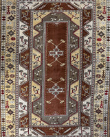 Vintage Turkish rug in living room setting, old rug, antique rug, pastel colors, faded colors, Turkish rug, vintage rug, soft rug, Portland, Oregon, rug store, rug shop, local shop
