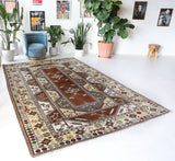 Vintage Turkish rug in living room setting, old rug, antique rug, pastel colors, faded colors, Turkish rug, vintage rug, soft rug, Portland, Oregon, rug store, rug shop, local shop
