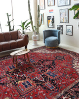 Antique Persian area rug in a living room setting, pile rug, vintage rug, portland, rug shop, bright colors, wild shaman, soft rug, bold color, Portland, Oregon, rug store, rug shop, local shop, antique rug, Persian rug, handmade rug, wool rug, distressed rug