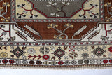 Vintage Turkish rug in living room setting, old rug, antique rug, pastel colors, faded colors, Turkish rug, vintage rug, soft rug, Portland, Oregon, rug store, rug shop, local shop