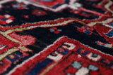 Antique Persian area rug in a living room setting, pile rug, vintage rug, portland, rug shop, bright colors, wild shaman, soft rug, bold color, Portland, Oregon, rug store, rug shop, local shop, antique rug, Persian rug, handmade rug, wool rug, distressed rug