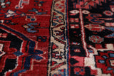 Antique Persian area rug in a living room setting, pile rug, vintage rug, portland, rug shop, bright colors, wild shaman, soft rug, bold color, Portland, Oregon, rug store, rug shop, local shop, antique rug, Persian rug, handmade rug, wool rug, distressed rug