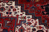 Antique Persian area rug in a living room setting, pile rug, vintage rug, portland, rug shop, bright colors, wild shaman, soft rug, bold color, Portland, Oregon, rug store, rug shop, local shop, antique rug, Persian rug, handmade rug, wool rug, distressed rug