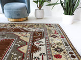 Vintage Turkish rug in living room setting, old rug, antique rug, pastel colors, faded colors, Turkish rug, vintage rug, soft rug, Portland, Oregon, rug store, rug shop, local shop