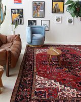 Antique Persian area rug in a living room setting, pile rug, vintage rug, portland, rug shop, bright colors, wild shaman, soft rug, bold color, Portland, Oregon, rug store, rug shop, local shop, antique rug, Persian rug, handmade rug, wool rug, distressed rug