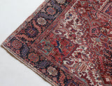Antique Persian area rug in a living room setting, pile rug, vintage rug, portland, rug shop, bright colors, wild shaman, soft rug, bold color, Portland, Oregon, rug store, rug shop, local shop, antique rug, Persian rug, handmade rug, wool rug, distressed rug