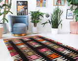 Vintage kilim rug in living room setting, bright colors, wild shaman, soft rug, bold color, Portland, Oregon, rug store, rug shop, local shop, vintage rug, modern kilim, warm colors