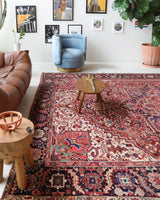 Antique Persian area rug in a living room setting, pile rug, vintage rug, portland, rug shop, bright colors, wild shaman, soft rug, bold color, Portland, Oregon, rug store, rug shop, local shop, antique rug, Persian rug, handmade rug, wool rug, distressed rug