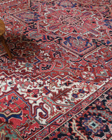 Antique Persian area rug in a living room setting, pile rug, vintage rug, portland, rug shop, bright colors, wild shaman, soft rug, bold color, Portland, Oregon, rug store, rug shop, local shop, antique rug, Persian rug, handmade rug, wool rug, distressed rug