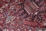 Antique Persian area rug in a living room setting, pile rug, vintage rug, portland, rug shop, bright colors, wild shaman, soft rug, bold color, Portland, Oregon, rug store, rug shop, local shop, antique rug, Persian rug, handmade rug, wool rug, distressed rug