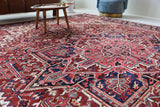 Antique Persian area rug in a living room setting, pile rug, vintage rug, portland, rug shop, bright colors, wild shaman, soft rug, bold color, Portland, Oregon, rug store, rug shop, local shop, antique rug, Persian rug, handmade rug, wool rug, distressed rug