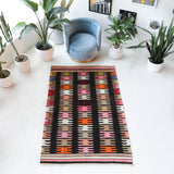 Vintage kilim rug in living room setting, bright colors, wild shaman, soft rug, bold color, Portland, Oregon, rug store, rug shop, local shop, vintage rug, modern kilim, warm colors