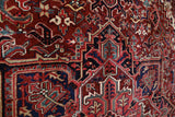 Antique Persian area rug in a living room setting, pile rug, vintage rug, portland, rug shop, bright colors, wild shaman, soft rug, bold color, Portland, Oregon, rug store, rug shop, local shop, antique rug, Persian rug, handmade rug, wool rug, distressed rug