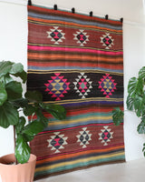 Vintage kilim rug in living room setting, bright colors, wild shaman, soft rug, bold color, Portland, Oregon, rug store, rug shop, local shop, vintage rug, modern kilim, warm colors