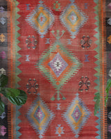 Vintage kilim rug in living room setting, old rug, antique rug, pastel colors, faded colors, Turkish rug, vintage rug, soft rug, Portland, Oregon, rug store, rug shop, local shop, earthy tones, earthy colors, warm colors