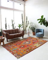 Vintage kilim rug in living room setting, bright colors, wild shaman, soft rug, bold color, Portland, Oregon, rug store, rug shop, local shop, vintage rug, modern kilim, warm colors