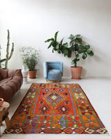 Vintage kilim rug in living room setting, bright colors, wild shaman, soft rug, bold color, Portland, Oregon, rug store, rug shop, local shop, vintage rug, modern kilim, warm colors