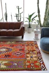 Vintage kilim rug in living room setting, bright colors, wild shaman, soft rug, bold color, Portland, Oregon, rug store, rug shop, local shop, vintage rug, modern kilim, warm colors