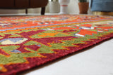 Vintage kilim rug in living room setting, bright colors, wild shaman, soft rug, bold color, Portland, Oregon, rug store, rug shop, local shop, vintage rug, modern kilim, warm colors