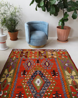 Vintage kilim rug in living room setting, bright colors, wild shaman, soft rug, bold color, Portland, Oregon, rug store, rug shop, local shop, vintage rug, modern kilim, warm colors