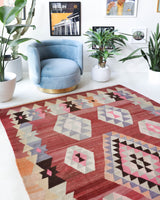 Vintage kilim rug in living room setting, old rug, antique rug, pastel colors, faded colors, Turkish rug, vintage rug, soft rug, Portland, Oregon, rug store, rug shop, local shop, earthy tones, earthy colors, warm colors