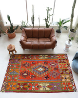 Vintage kilim rug in living room setting, bright colors, wild shaman, soft rug, bold color, Portland, Oregon, rug store, rug shop, local shop, vintage rug, modern kilim, warm colors